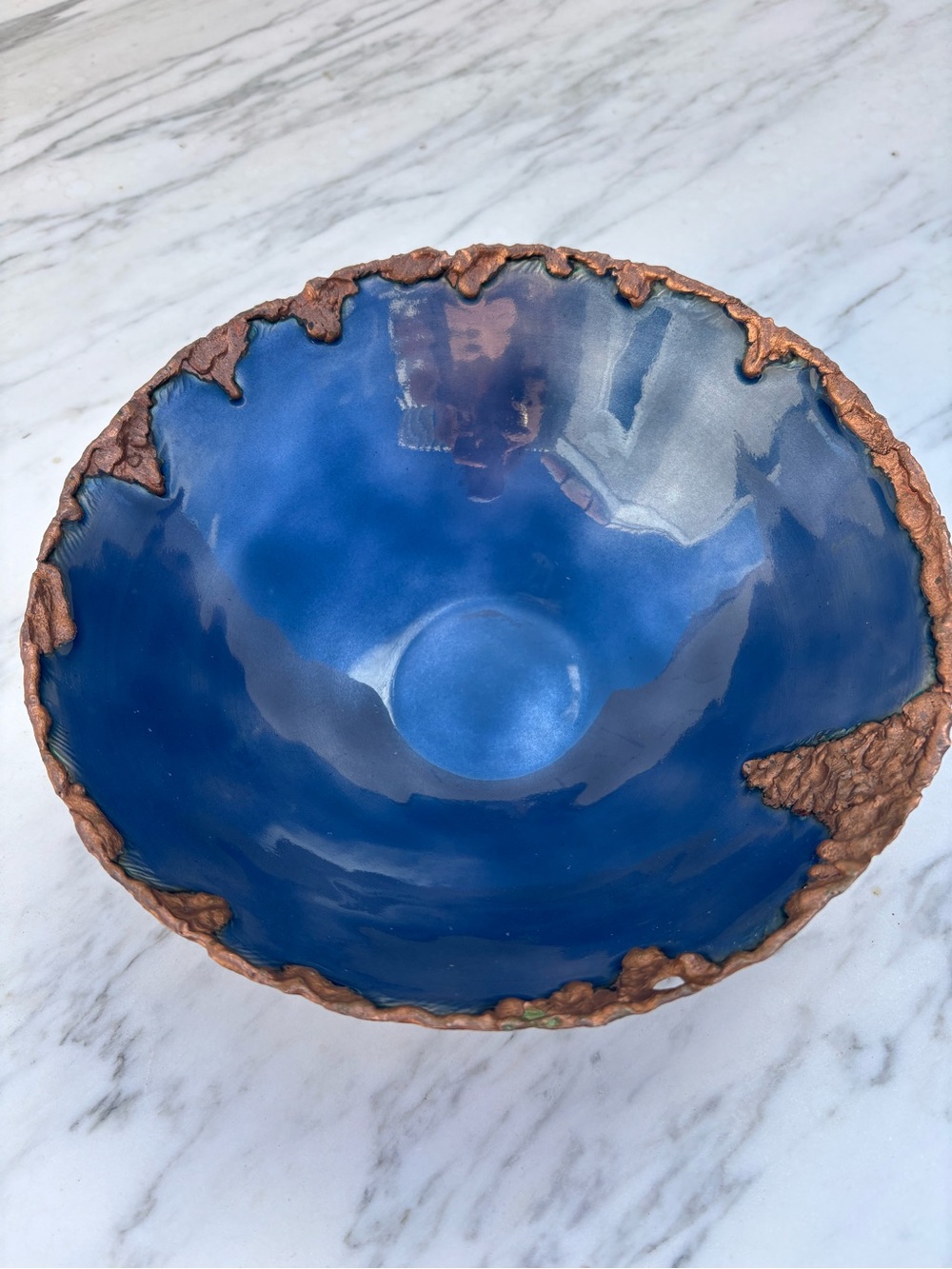 Butte Copper Co. Decorative blue enamel bowl with melted copper rim